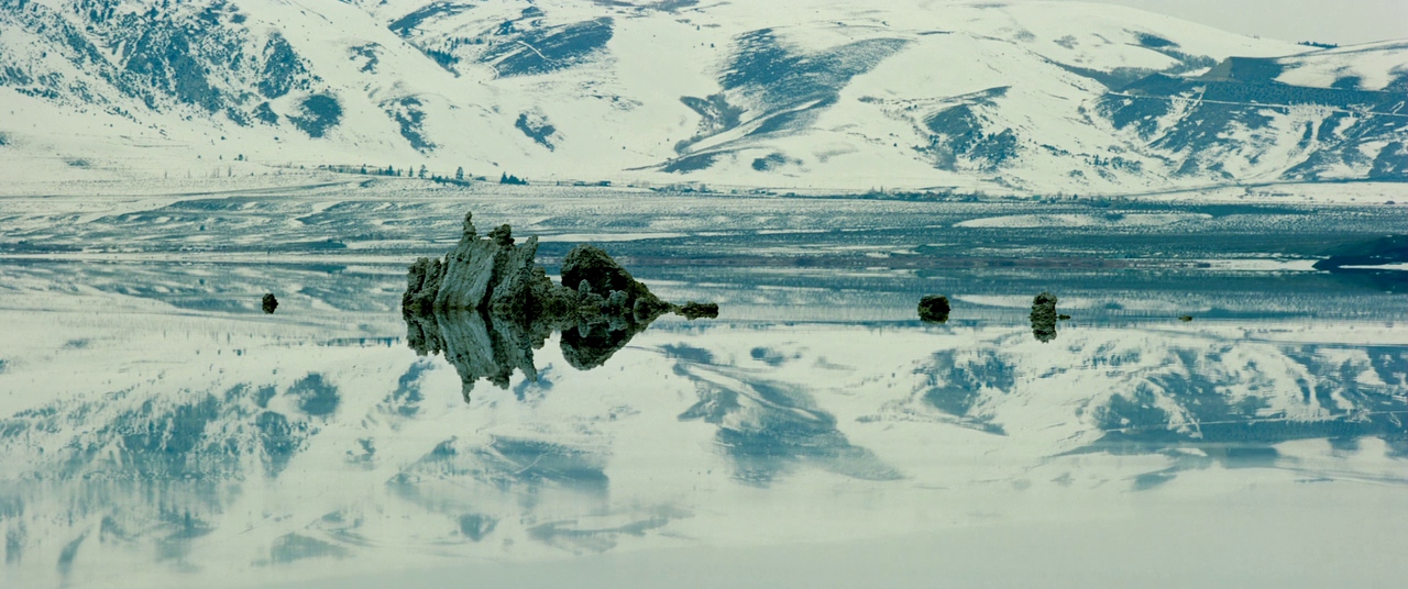 Snowy mountains reflected in Mono Lake in Baraka
